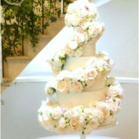 6-tier White Ivory Rose and Orchids Floral Cascade Spiral Wedding Cake for Eastington Park Manor House Gloucestershire Cherie Kelly London