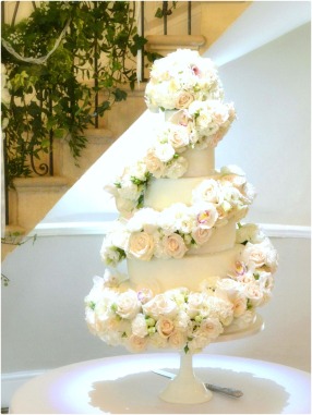 6-tier White Ivory Rose and Orchids Floral Cascade Spiral Wedding Cake for Eastington Park Manor House Gloucestershire Cherie Kelly London