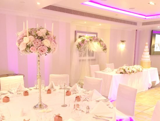 Pink and lilac tall candelabra wedding centrepieces with roses flowers Cherie Kelly London Sofitel St James 