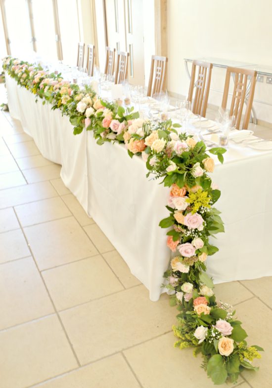 Rustic Orange and Peach Headtable Flower Garland Wedding Flowers Centrepiece at Rivervale Barn Hampshire Cherie Kelly