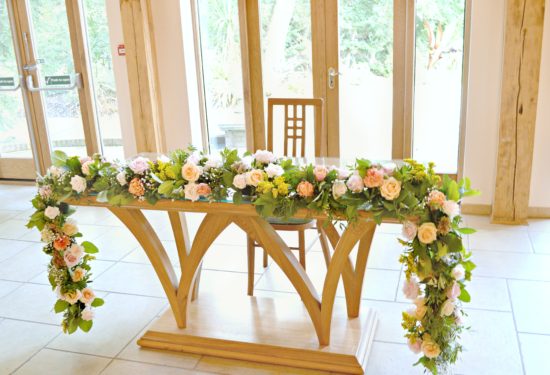 Rustic Orange and Peach Wedding Ceremony Registrar Garland Flowers at Rivervale Barn Hampshire Cherie Kelly